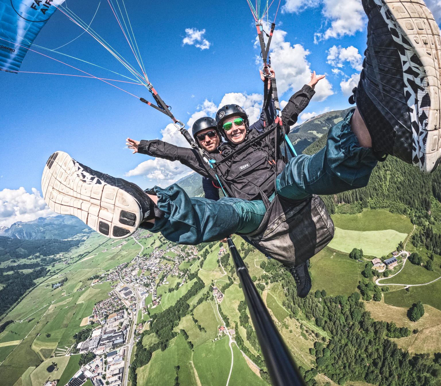 Woman having fun paragliding in Zell am See